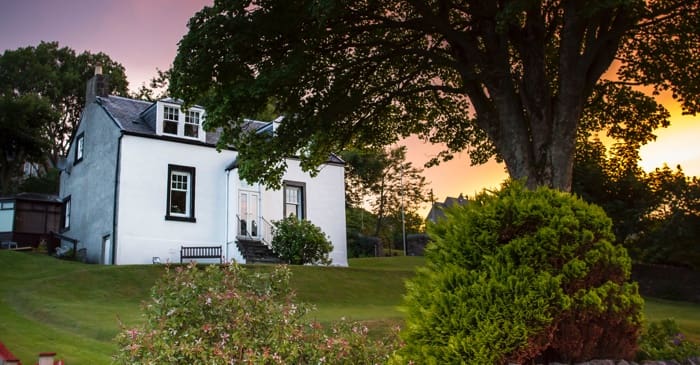 White house on hill that is in probate.